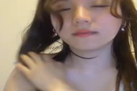enchanting youthful oriental shemale Showing Off Her stunning Body And Jerking Her dick