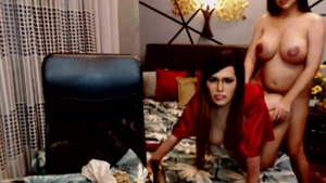 Two cute trannies Cumming Hard On cam