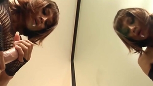 Redhead Ladyboy In darksome lingerie Sucks A fake penis By The Mirror